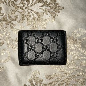 Mens gucci GG embossed bi-fold wallet